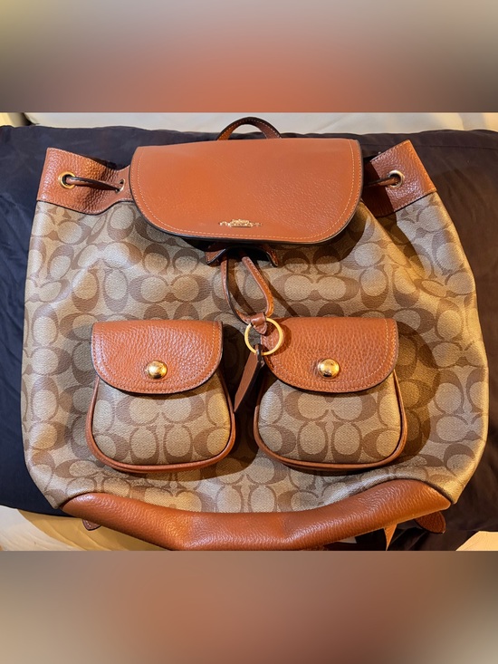 Coach Handbags - Coach Outlet Signature Canvas Drawstring Backpack in Brown/Tan, Gently Used.